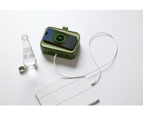 Green Byrne Thesis with an iPad plugged into it and an iPhone wirelessly charging on top